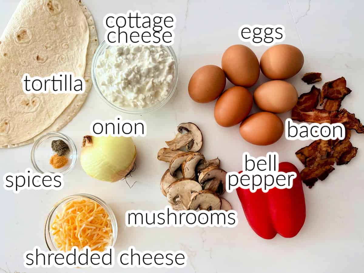 Ingredients on table: tortilla, cottage cheese, eggs, bacon, bell pepper, mushrooms, shredded cheese, onion, and spices.