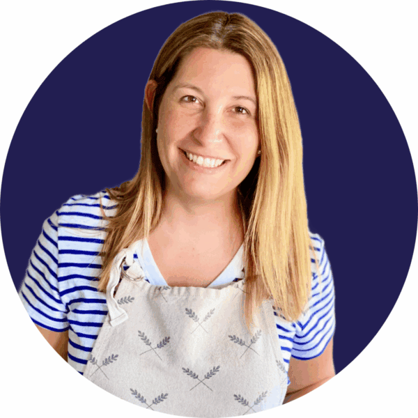 female with apron on and blue background