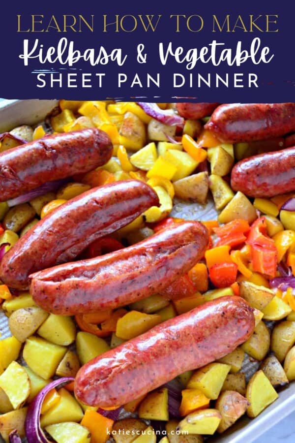 Sheet pan with sausage links, potatoes, red onions, and peppers with text on image for Pinterest.
