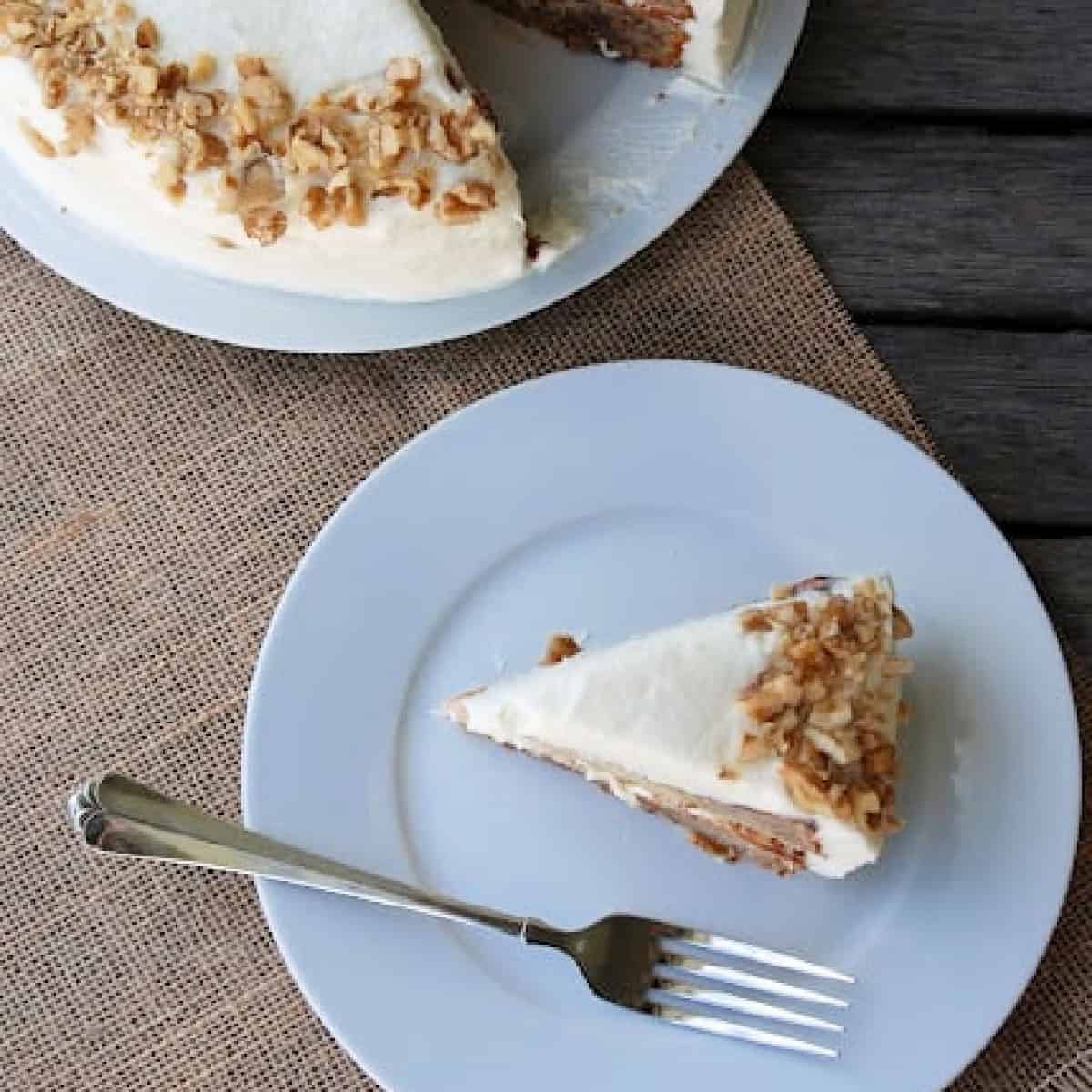 Slice of banana cream cake on a white plate.